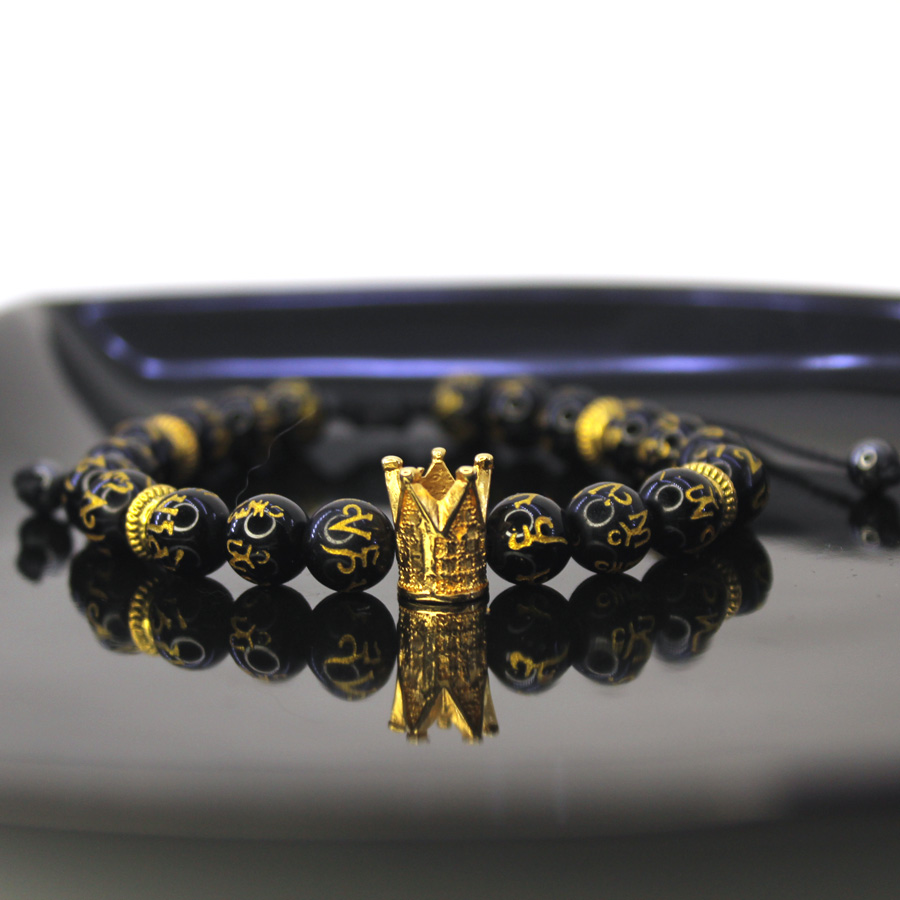P305 Pulseira Obsidiana Negra com Coroa (1) Pulseira Obsidiana Negra com Coroa Dourada